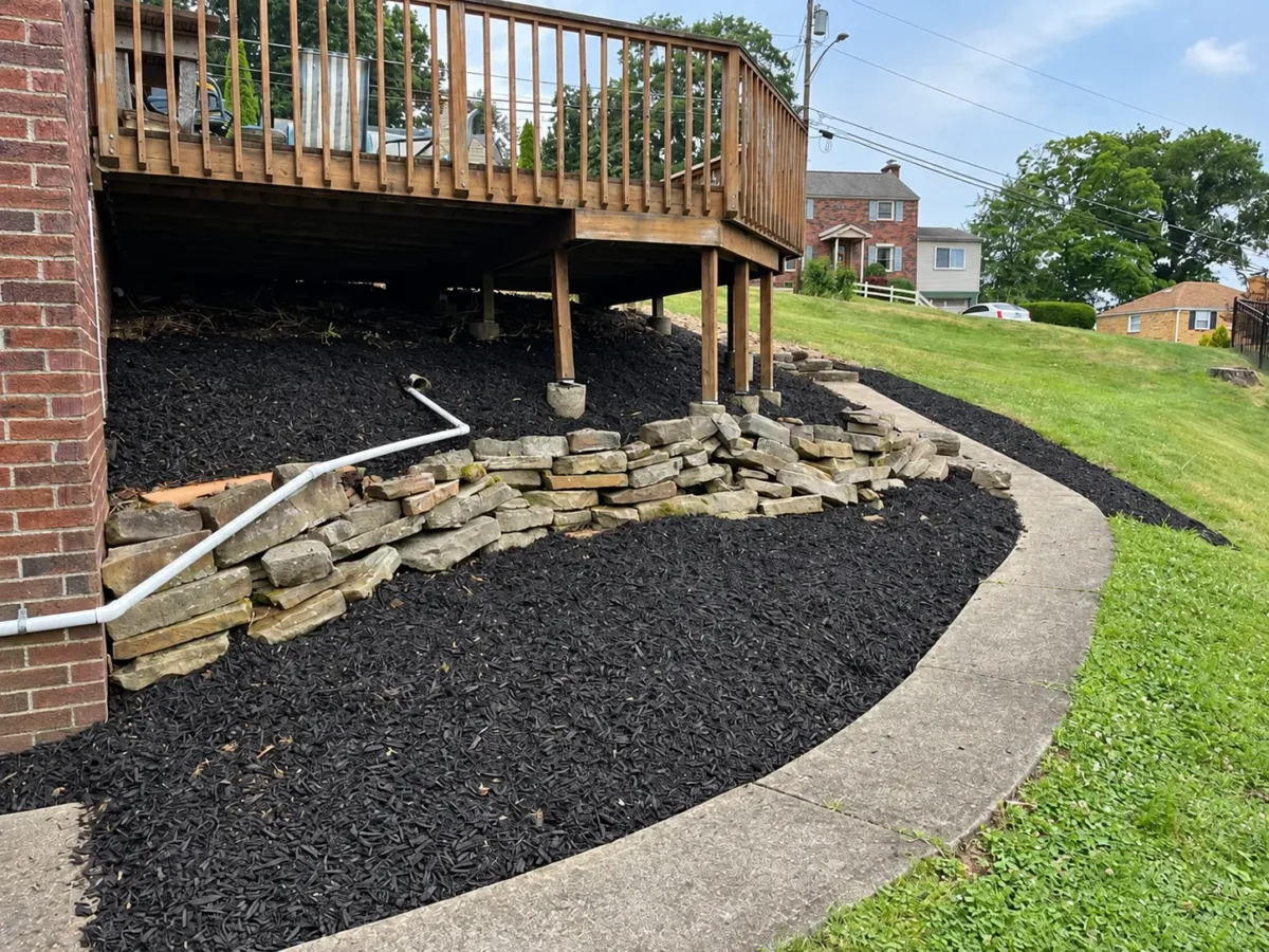 Fresh Mulch Installation Around Backyard Deck